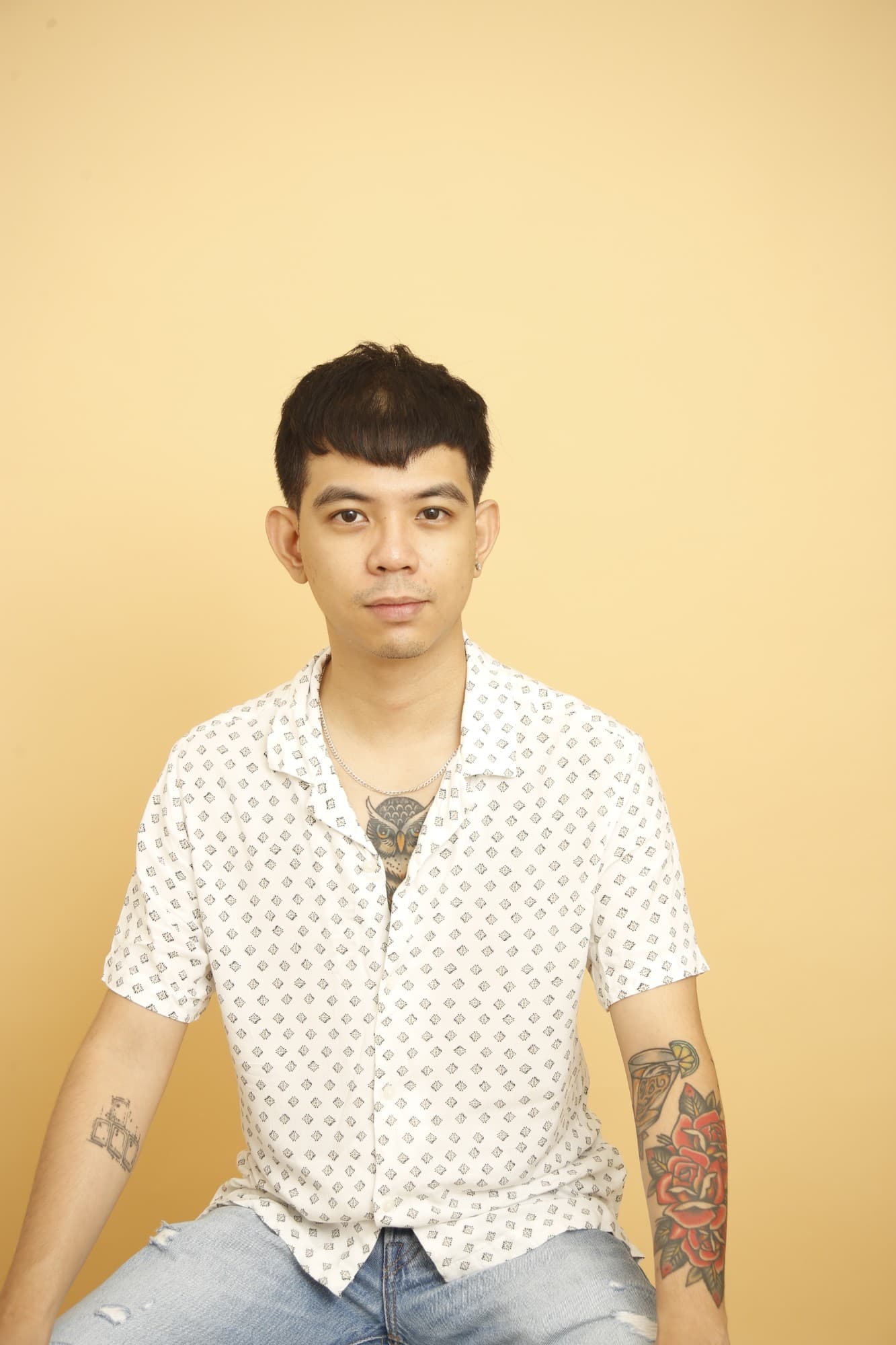 Reidel, the designer and developer behind Studio Reidel, seated against an amber backdrop